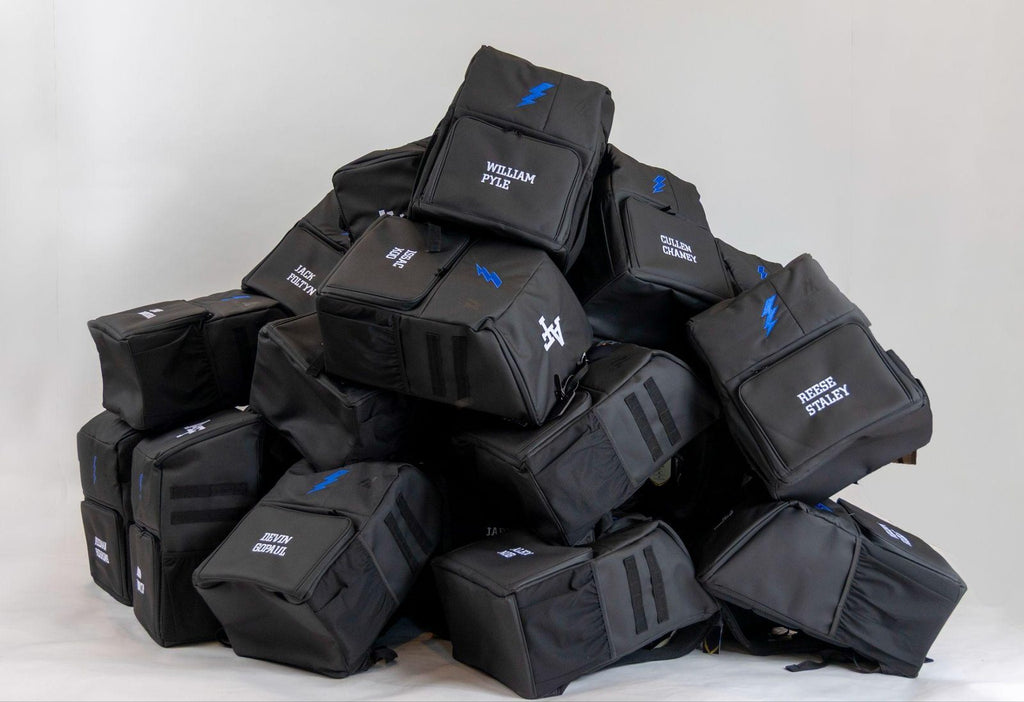 Stack of personalized Locked In Athletics team backpacks